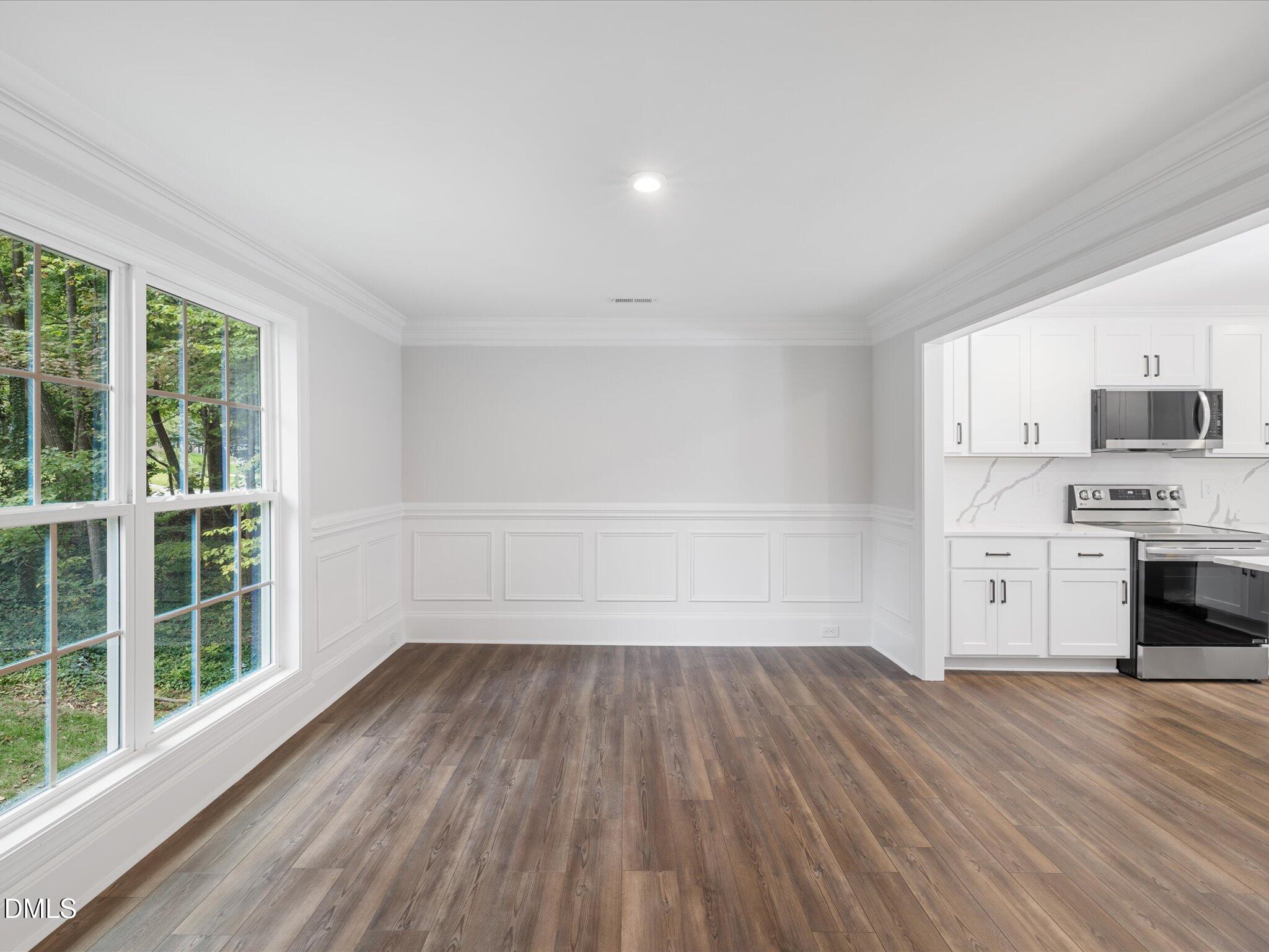 316 Howland Avenue Cary, NC 27513 - Photo 14 of 34 a view of kitchen and wooden floor