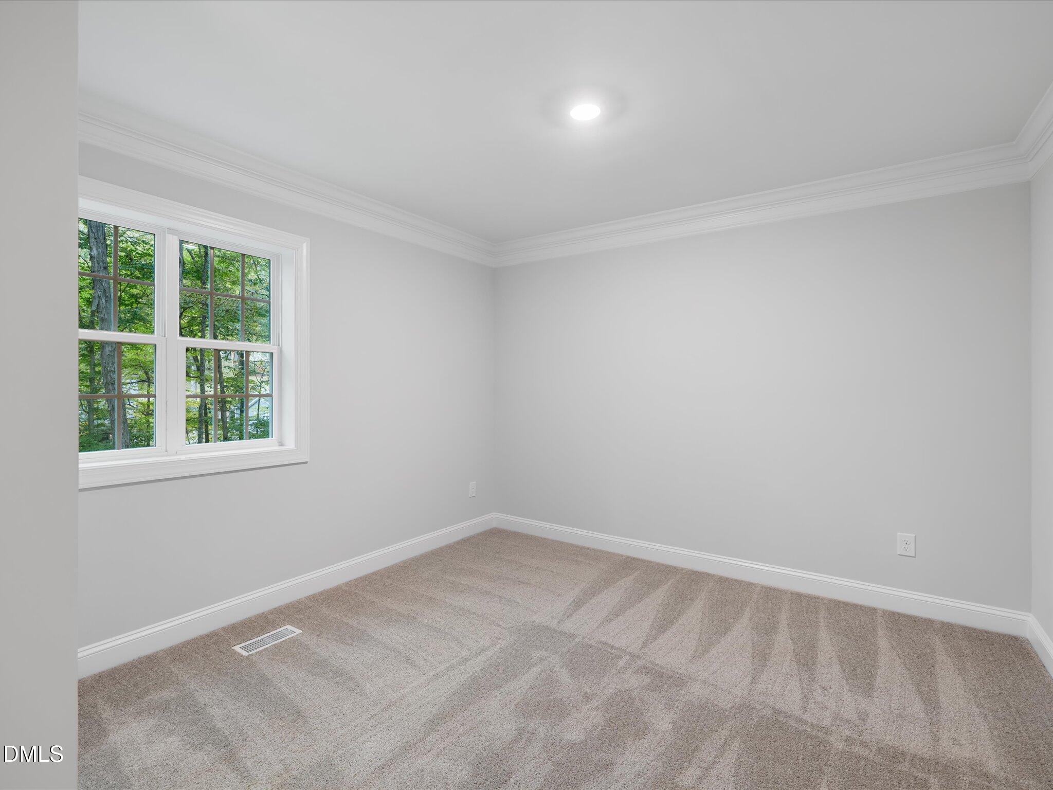 316 Howland Avenue Cary, NC 27513 - Photo 23 of 34 an empty room with a window