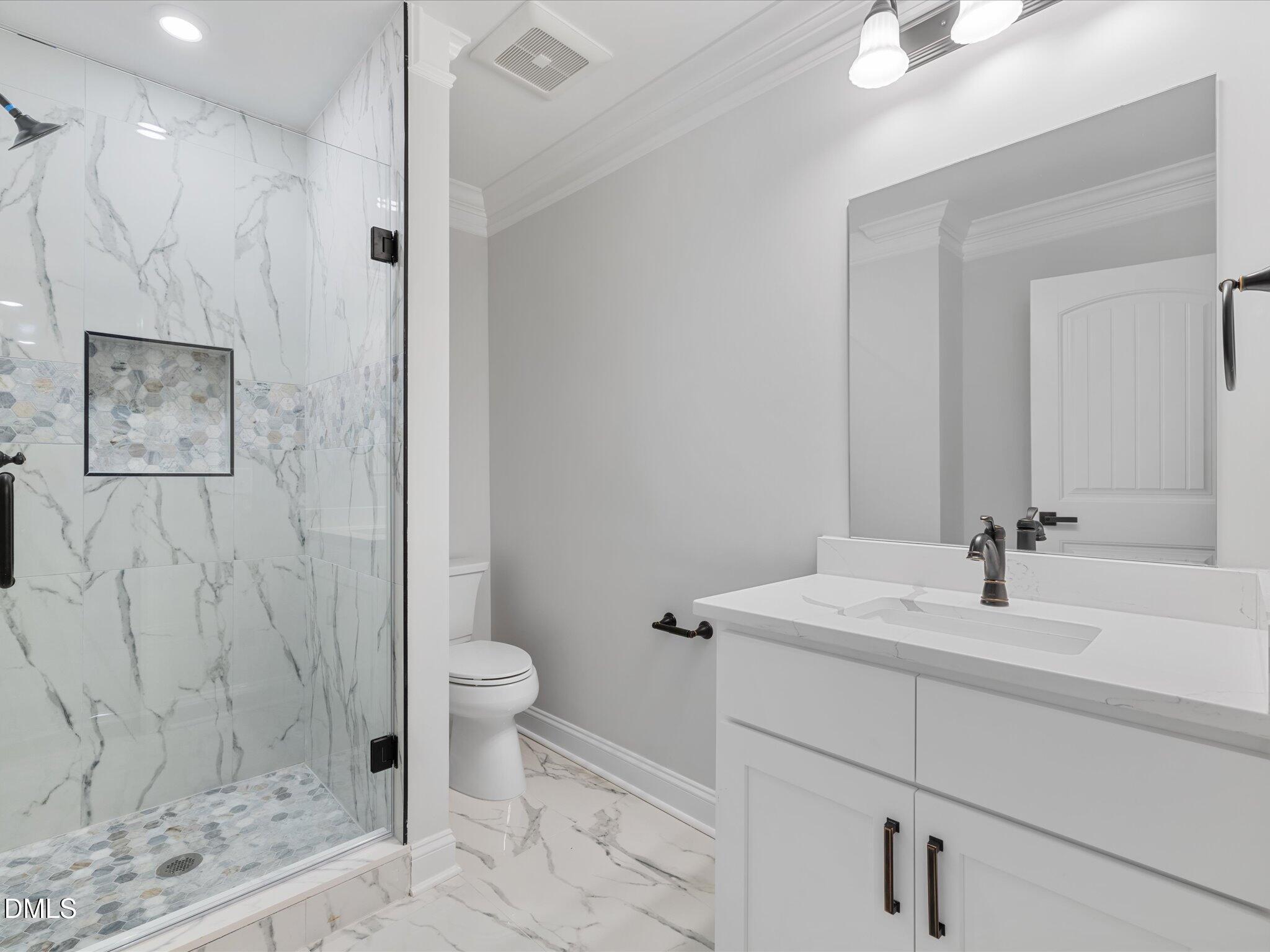 316 Howland Avenue Cary, NC 27513 - Photo 25 of 34 a bathroom with a sink toilet and shower