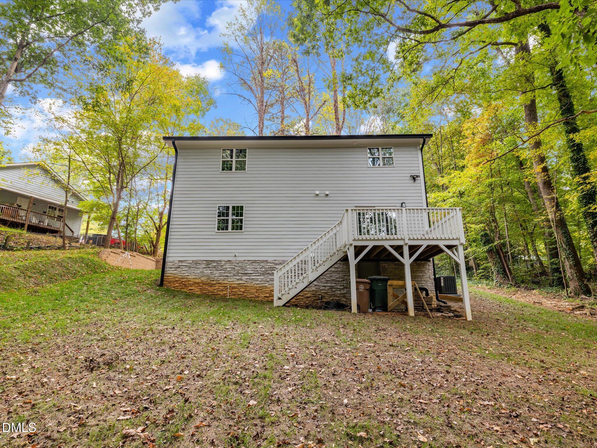 316 Howland Avenue Cary, NC 27513 - Photo 30 of 34 a view of a house with a back yard