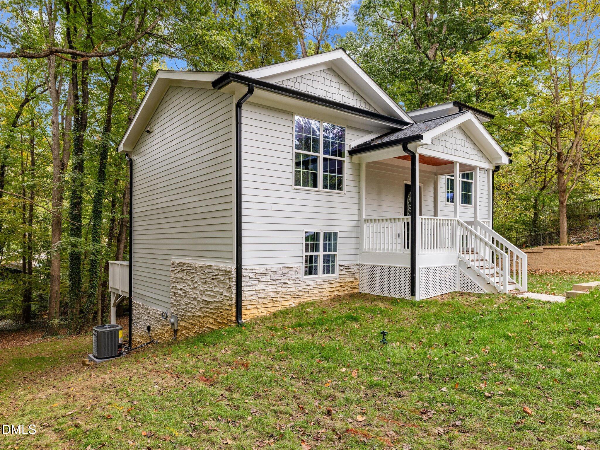 316 Howland Avenue Cary, NC 27513 - Photo 3 of 34 a view of a house with a yard