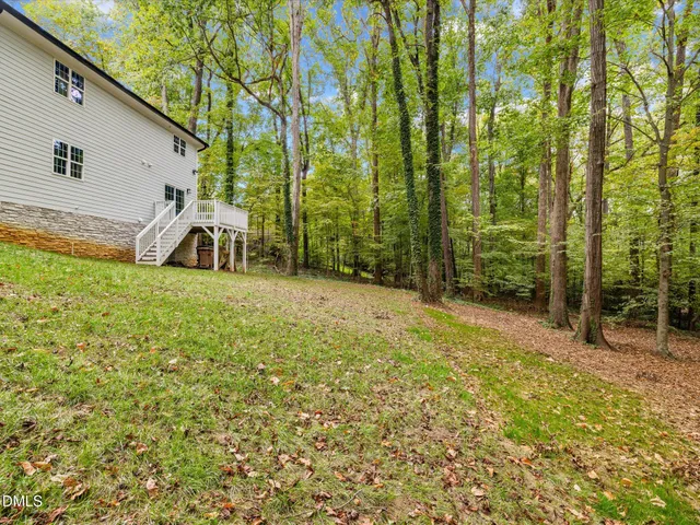 a view of balcony with wooden floor and fence