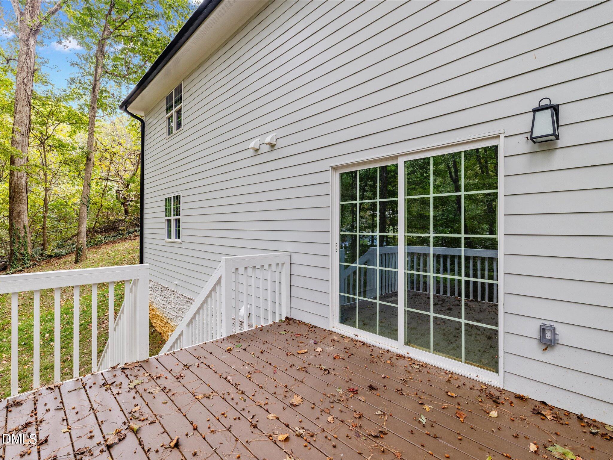 316 Howland Avenue Cary, NC 27513 - Photo 34 of 34 a view of a balcony with a potted plant and a large window