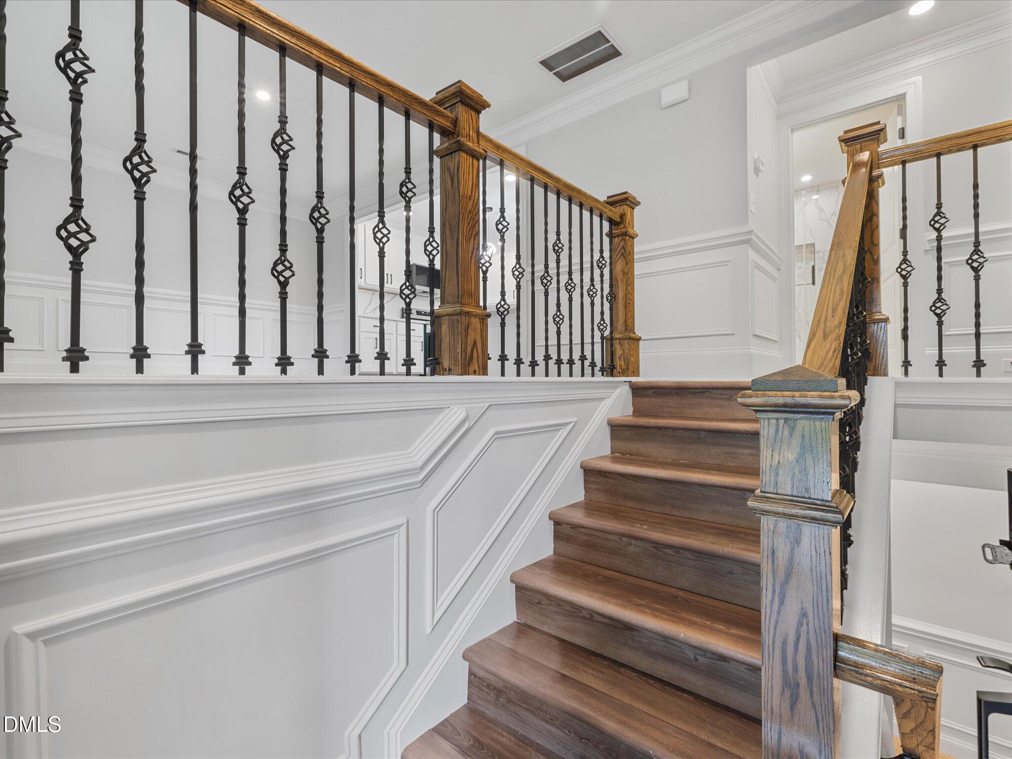 316 Howland Avenue Cary, NC 27513 - Photo 8 of 34 a view of entryway with wooden floor and stairs