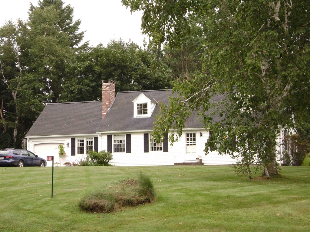 208 Rolling Ridge Road Amherst, MA 01002 - Photo 1 of 40 a front view of a house with a garden