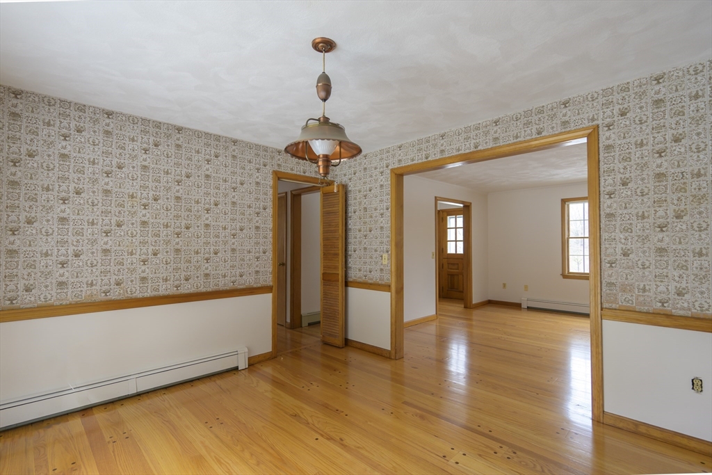 208 Rolling Ridge Road Amherst, MA 01002 - Photo 11 of 40 a view of hallway with chandelier and wooden floor