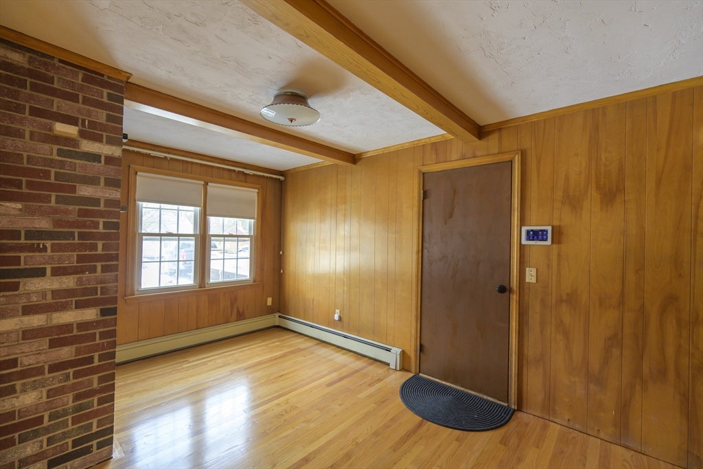 208 Rolling Ridge Road Amherst, MA 01002 - Photo 13 of 40 a view of a hallway with wooden floor and front door