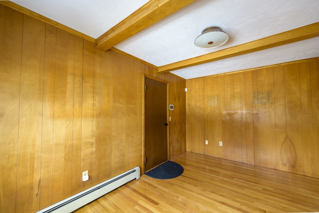 208 Rolling Ridge Road Amherst, MA 01002 - Photo 15 of 40 a view of an empty room and wooden floor