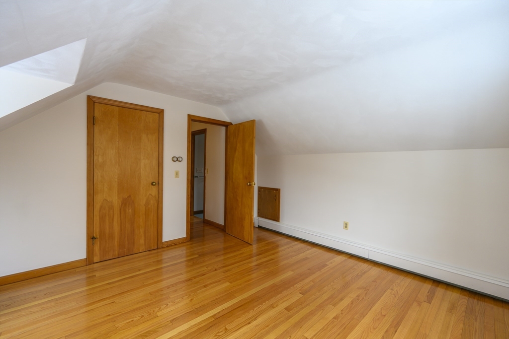 208 Rolling Ridge Road Amherst, MA 01002 - Photo 18 of 40 a view of an empty room with wooden floor