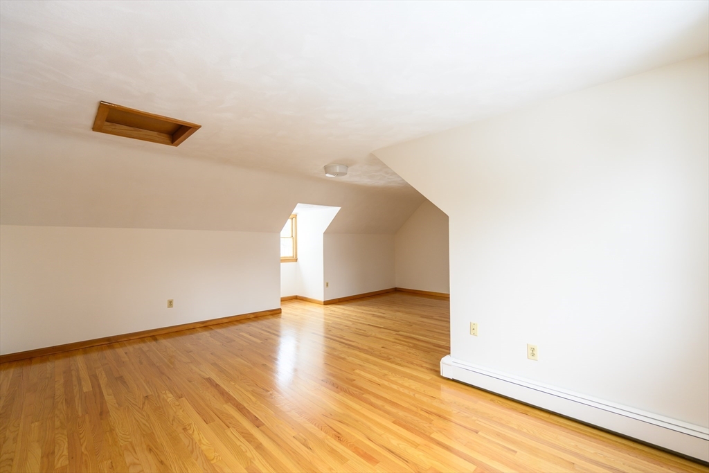 208 Rolling Ridge Road Amherst, MA 01002 - Photo 19 of 40 a view of an empty room with wooden floor