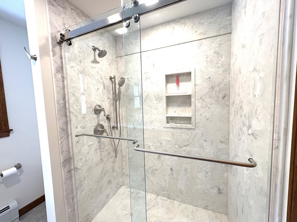 208 Rolling Ridge Road Amherst, MA 01002 - Photo 31 of 40 a bathroom with a glass shower door
