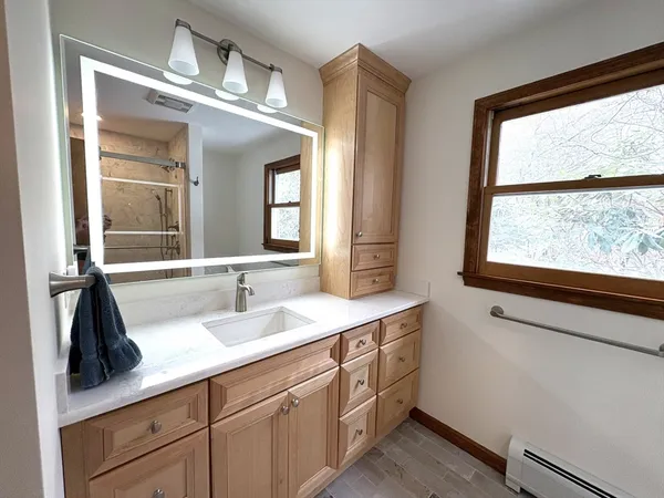 a bathroom with a sink and a mirror