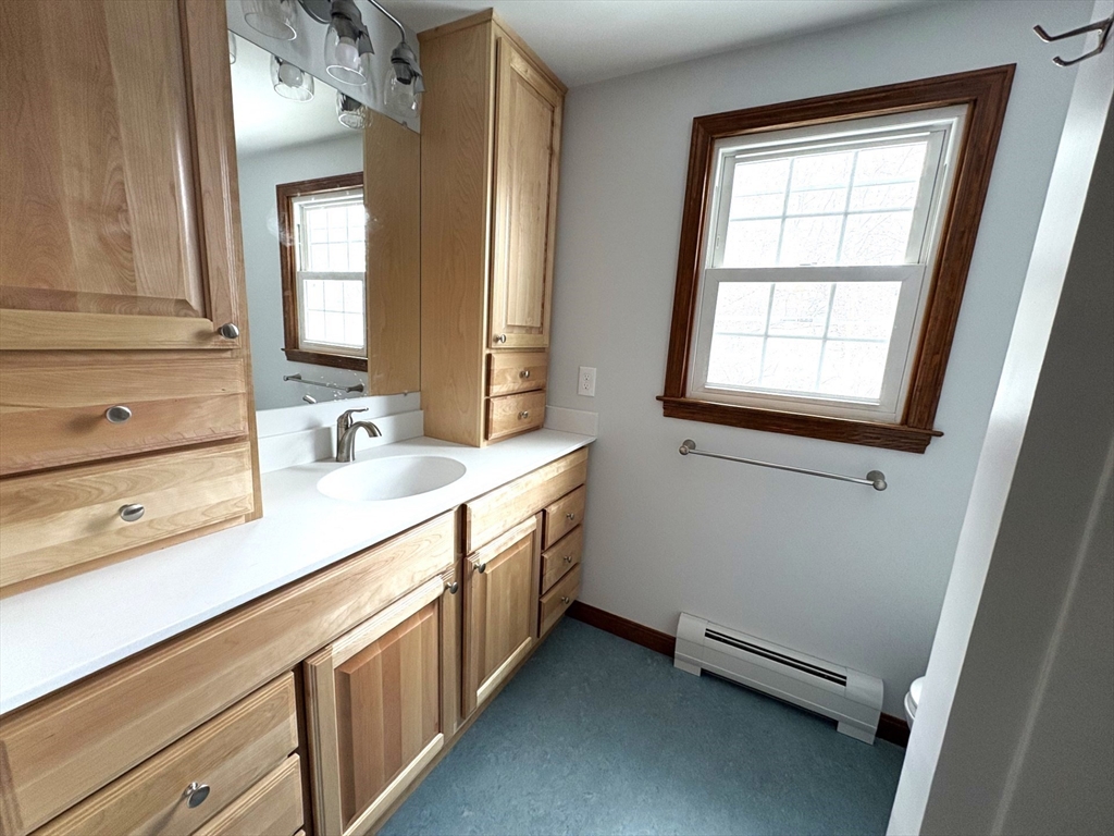 208 Rolling Ridge Road Amherst, MA 01002 - Photo 36 of 40 a bathroom with a double vanity sink and a window