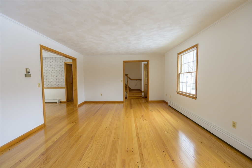 208 Rolling Ridge Road Amherst, MA 01002 - Photo 7 of 40 a view of empty room with wooden floor and fan