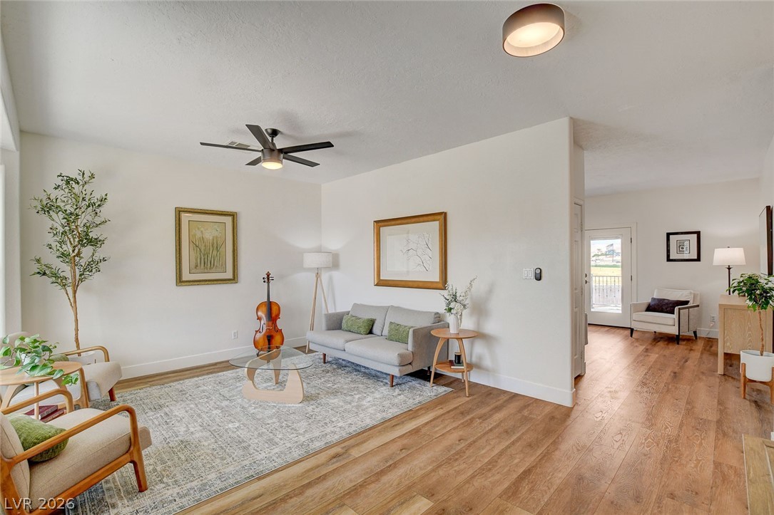 4362 Thistle Street Logandale, NV 89021 - Photo 9 of 99 Blended living and dining areas feature light LVP floors and an inviting layout.