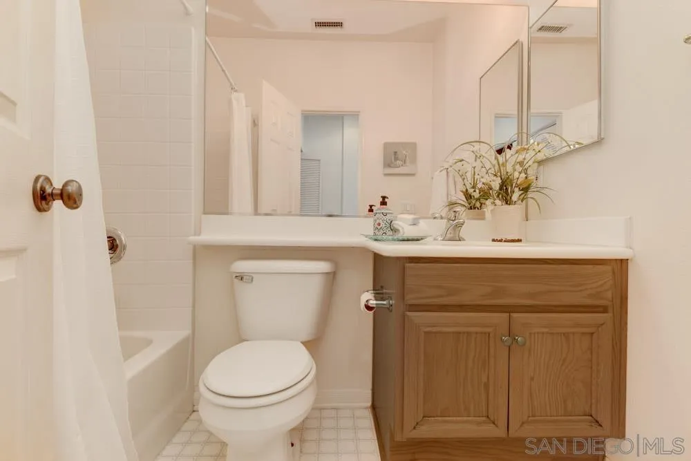 11650 Miro Circle San Diego, CA 92131 - Photo 20 of 28 a bathroom with a sink toilet and mirror