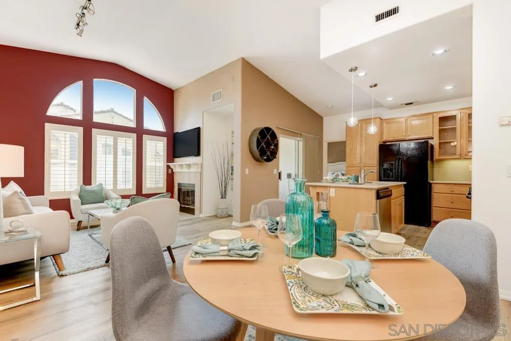 11650 Miro Circle San Diego, CA 92131 - Photo 4 of 28 a living room with fireplace furniture and a large window