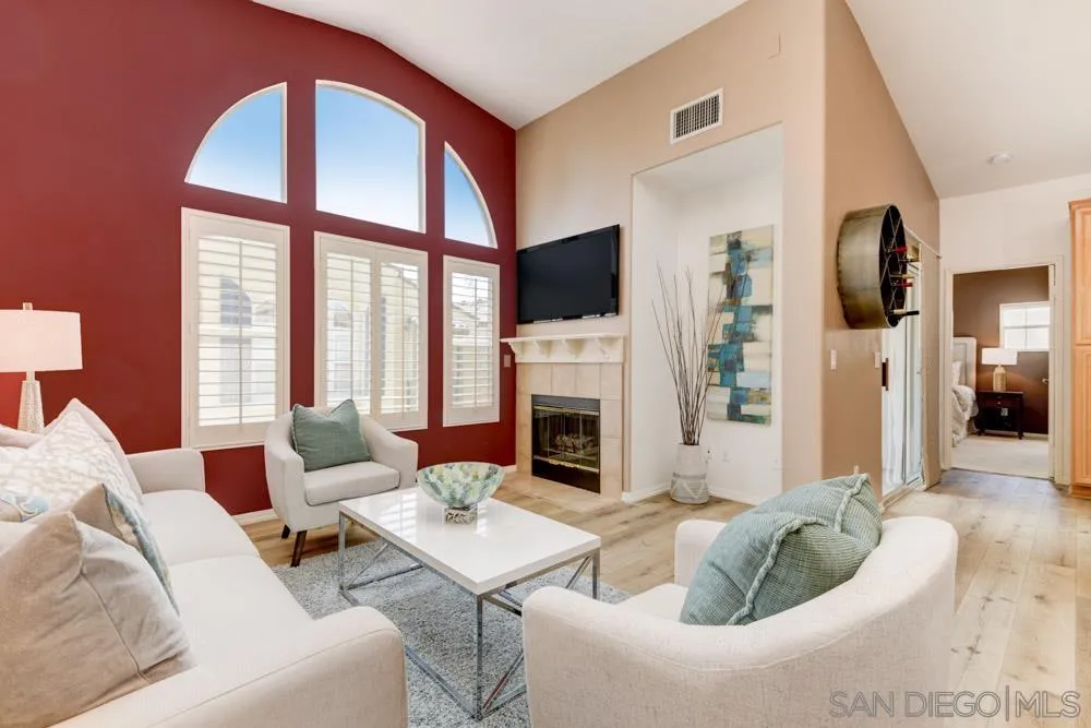 11650 Miro Circle San Diego, CA 92131 - Photo 6 of 28 a living room with furniture fireplace and a large window