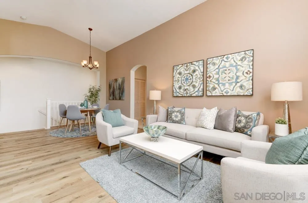 11650 Miro Circle San Diego, CA 92131 - Photo 8 of 28 a living room with furniture a table and a lamp