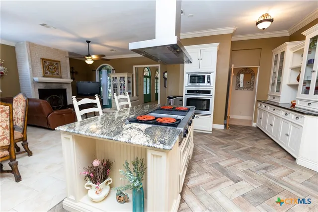 a living room with furniture flat screen tv and a fireplace
