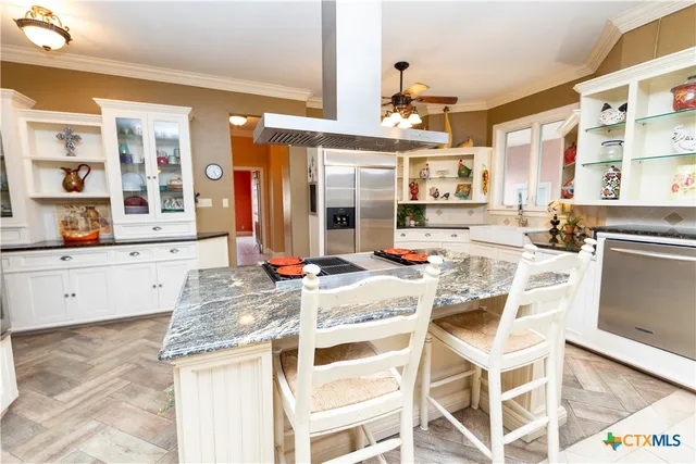 a dining room with furniture and a window