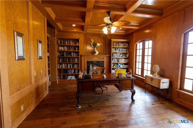 a view of hallway with livingroom and furniture