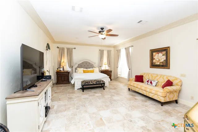 a large spacious bathroom with a large tub shower and windows