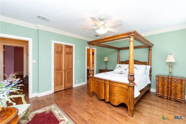 a bathroom with a sink a toilet and shower curtain