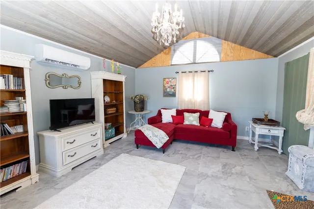 a view of a livingroom with furniture and windows