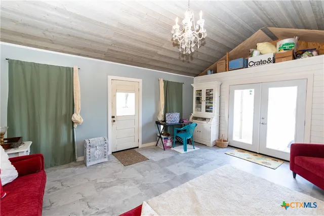a front view of a house with a yard table and chairs