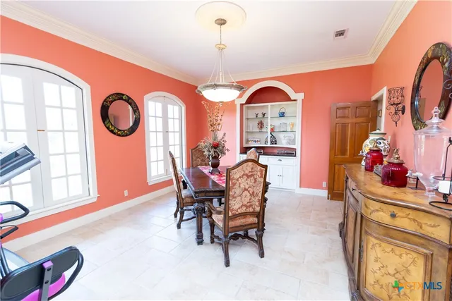a en suite bathroom with a tub sink and mirror