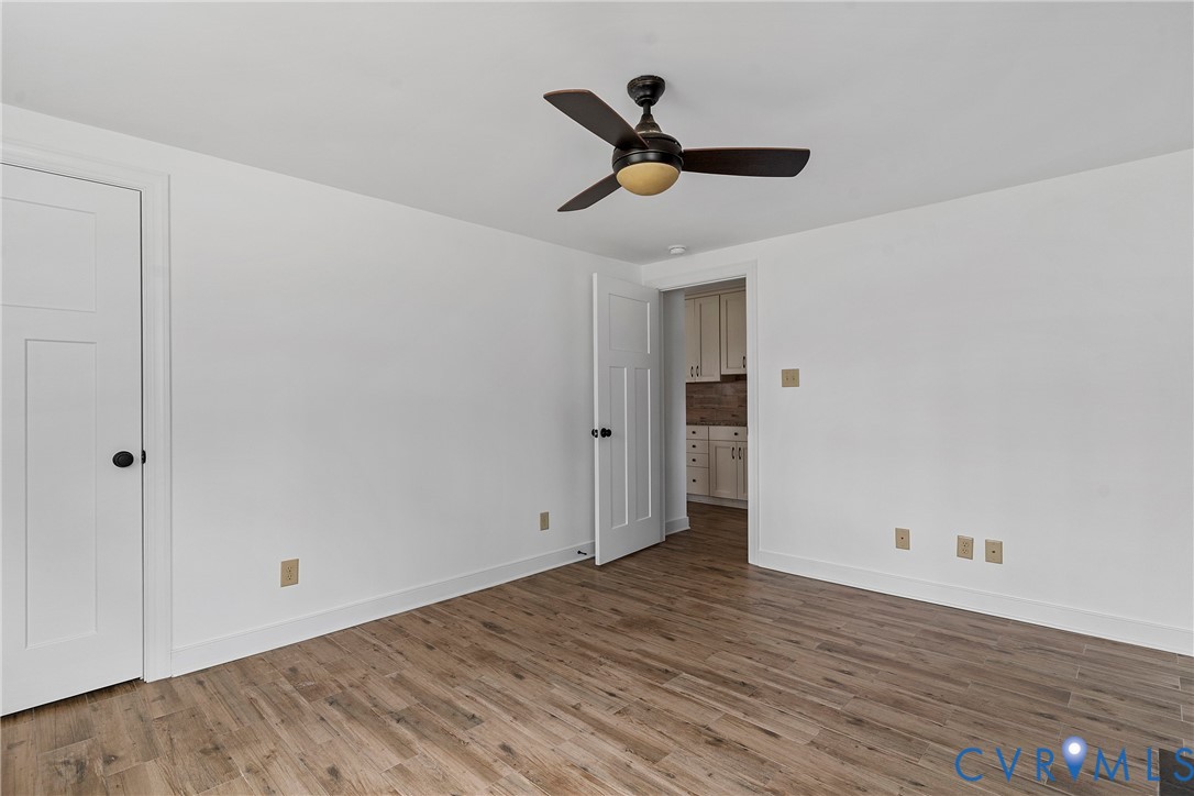15141 Brown Pleasants Road Montpelier, VA 23192 - Photo 25 of 46 Unfurnished bedroom featuring wood finished floors