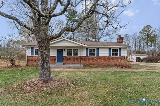 a view of a yard with a tree