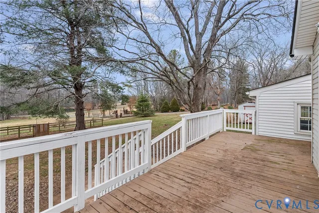a view of a field with trees in the background