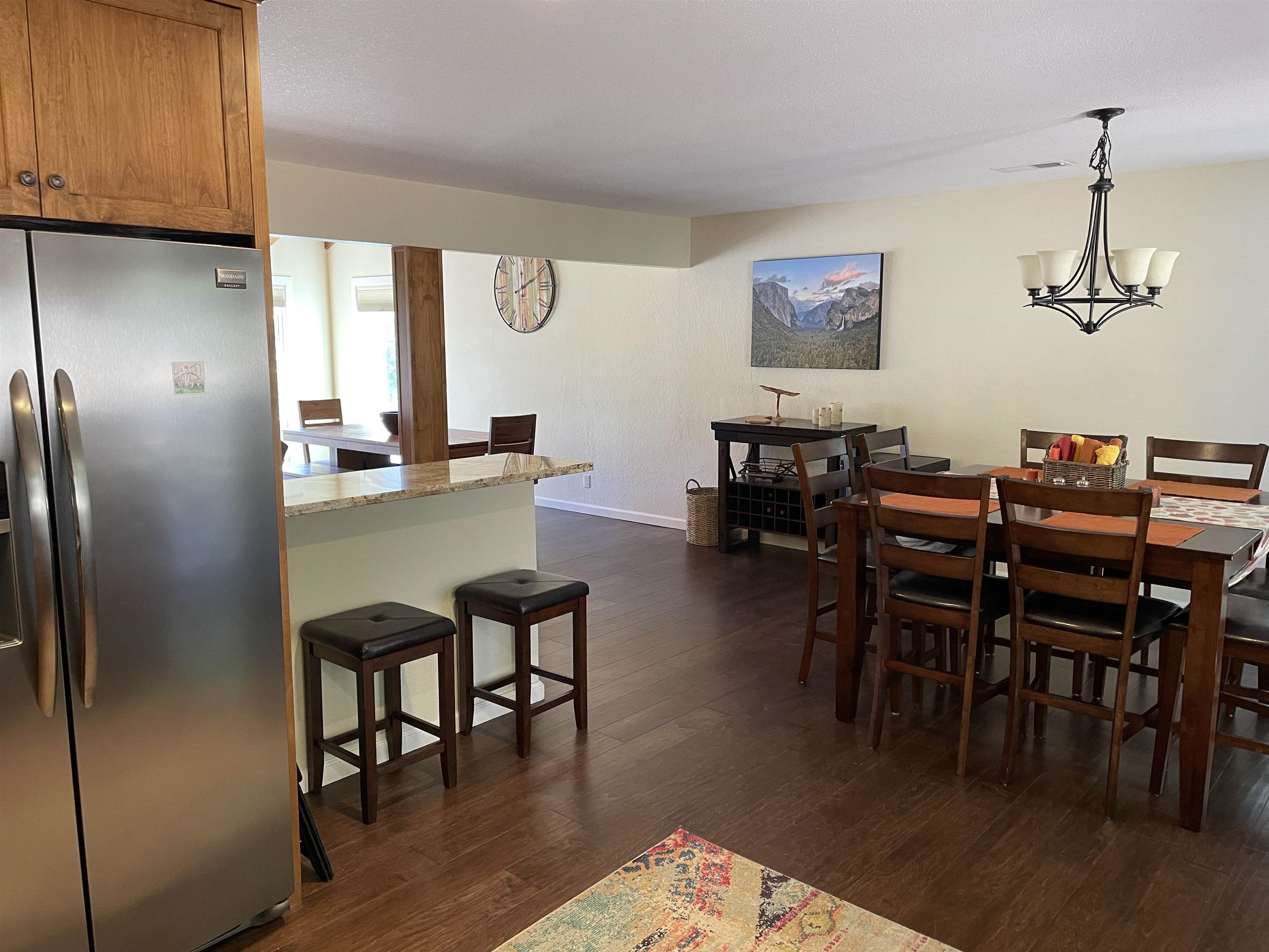 831 Timber Ridge Road Lake Almanor, CA 96137 - Photo 13 of 36 a dining room with furniture window and wooden floor