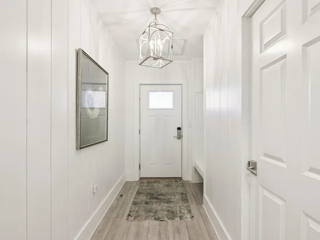 a kitchen with stainless steel appliances a sink stove and cabinets