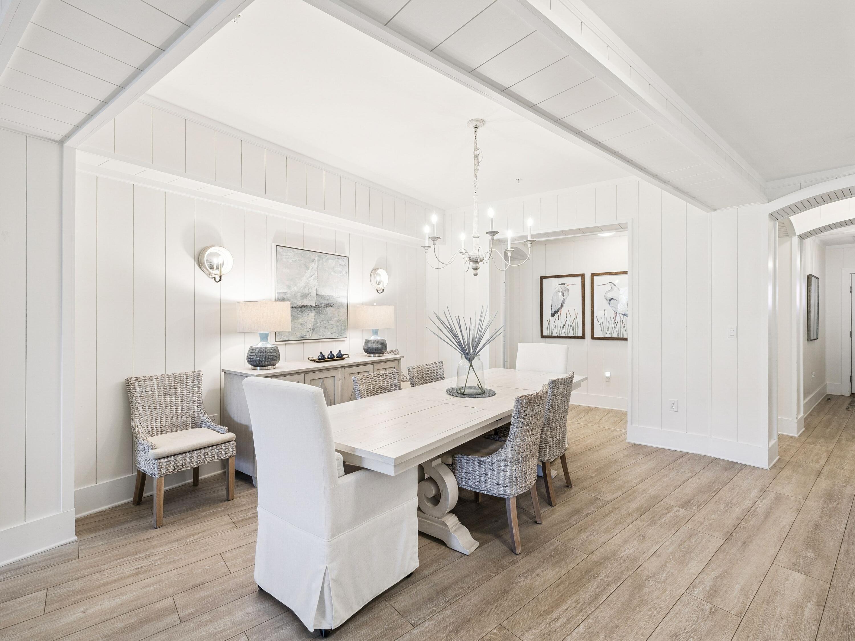 56 Blue Mountain Road, Unit B304 Santa Rosa Beach, FL 32459 - Photo 16 of 47 a view of a dining room with furniture and wooden floor