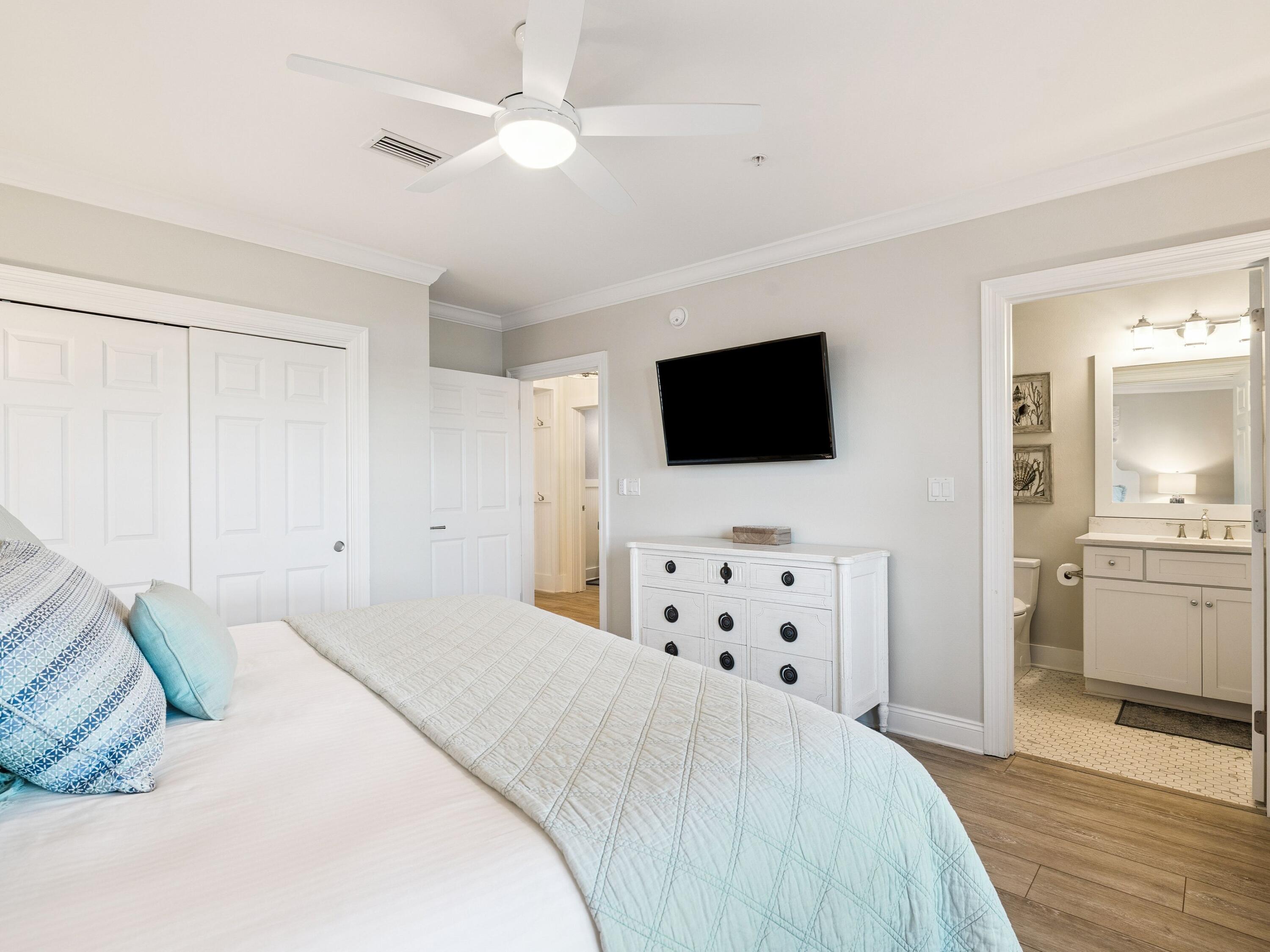 56 Blue Mountain Road, Unit B304 Santa Rosa Beach, FL 32459 - Photo 20 of 47 a bedroom with a bed window and a flat screen tv