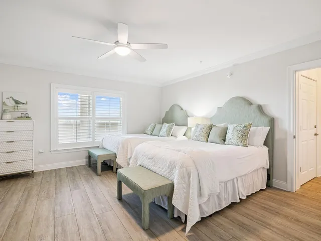 a bathroom with a bath tub sink mirror vanity and toilet