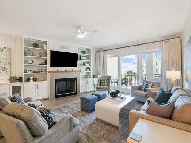 a living room with fireplace furniture and a flat screen tv