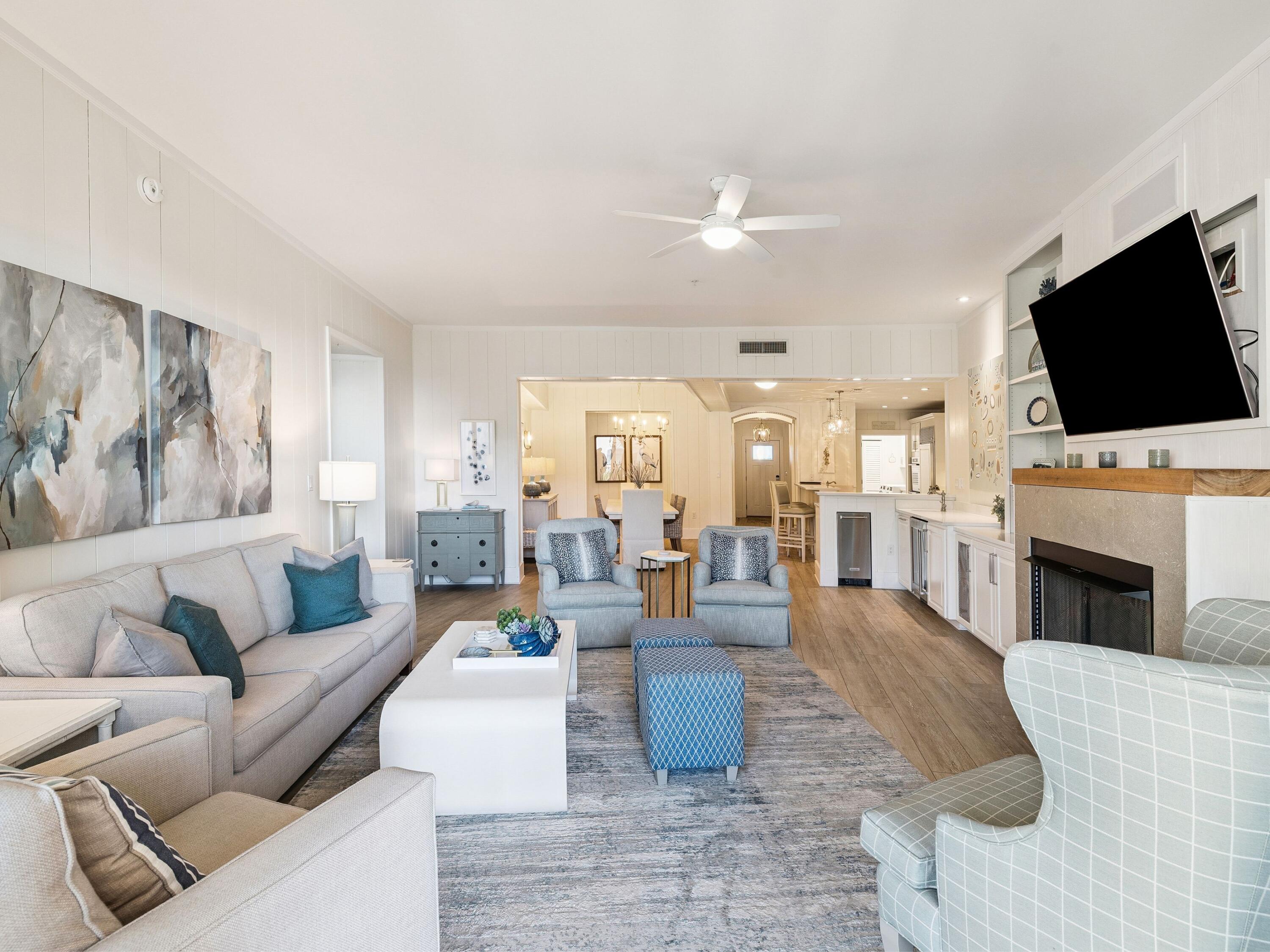 56 Blue Mountain Road, Unit B304 Santa Rosa Beach, FL 32459 - Photo 26 of 47 a living room with fireplace furniture and a flat screen tv