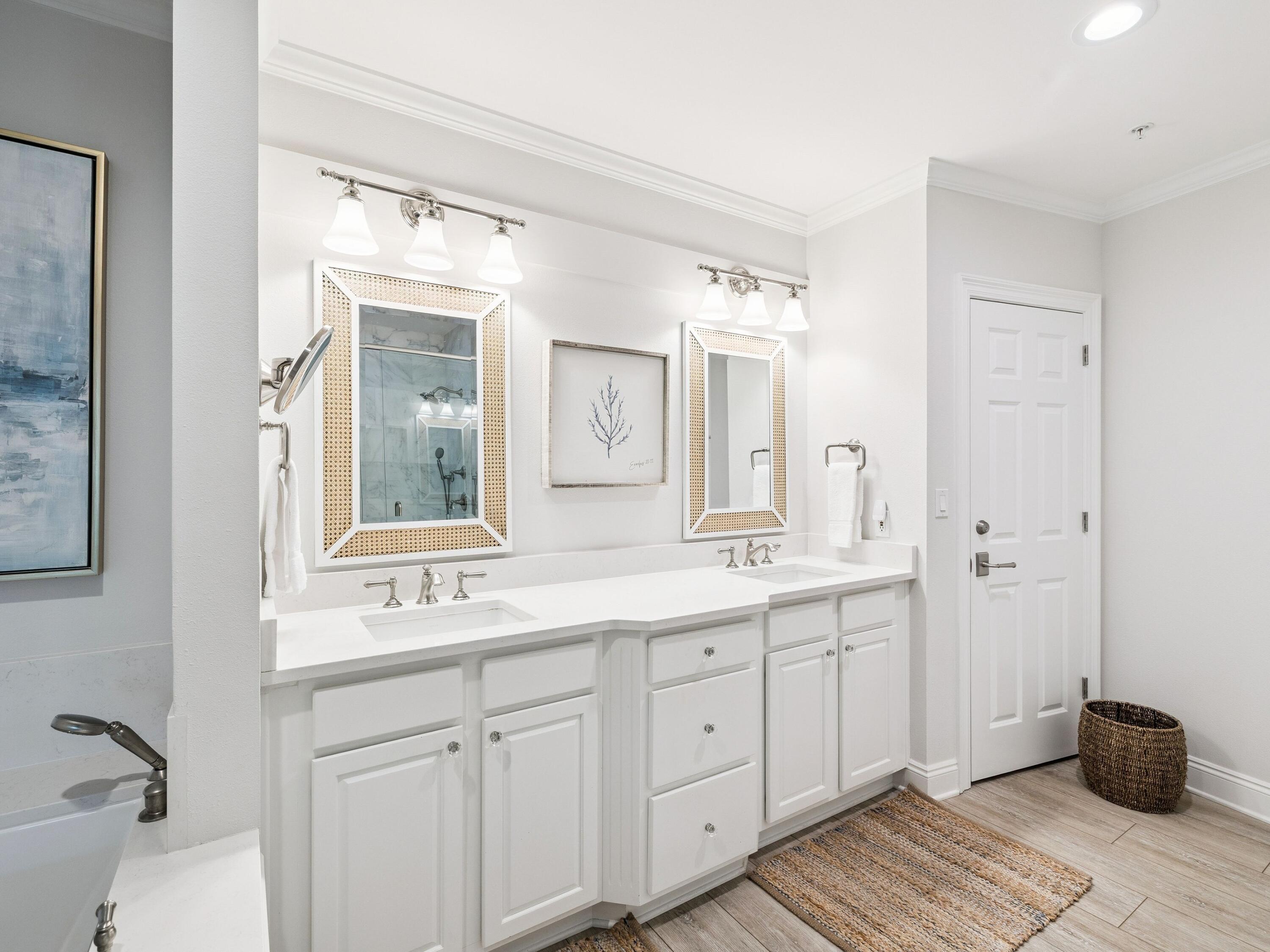 56 Blue Mountain Road, Unit B304 Santa Rosa Beach, FL 32459 - Photo 29 of 47 a bathroom with a double vanity sink and mirror