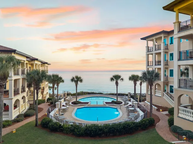 an aerial view of a house with swimming pool garden and outdoor seating
