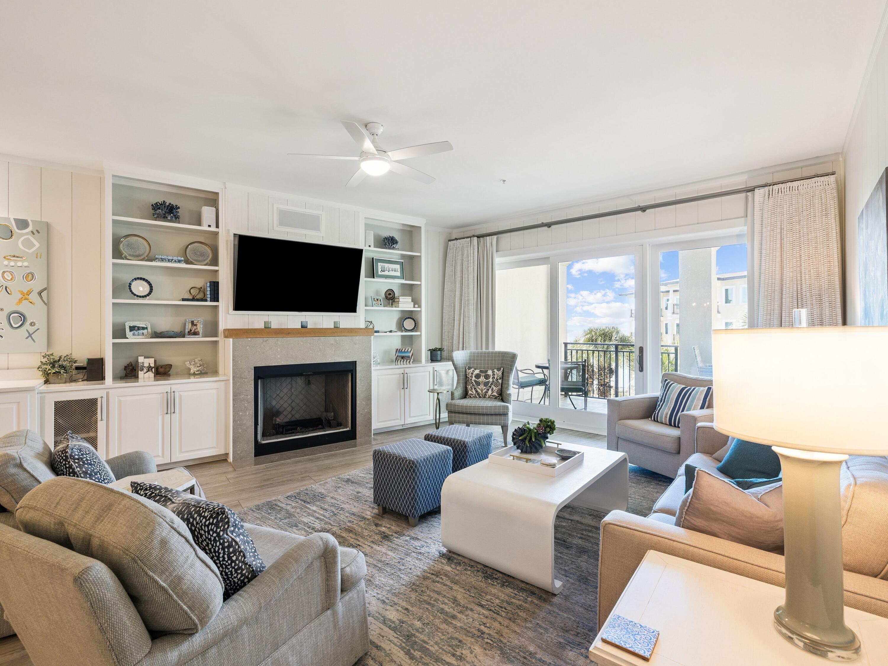 56 Blue Mountain Road, Unit B304 Santa Rosa Beach, FL 32459 - Photo 6 of 47 a living room with furniture a fireplace and a flat screen tv