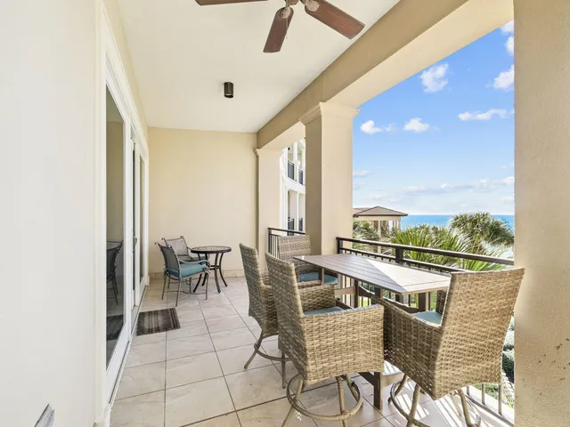 a view of a swimming pool with outdoor seating
