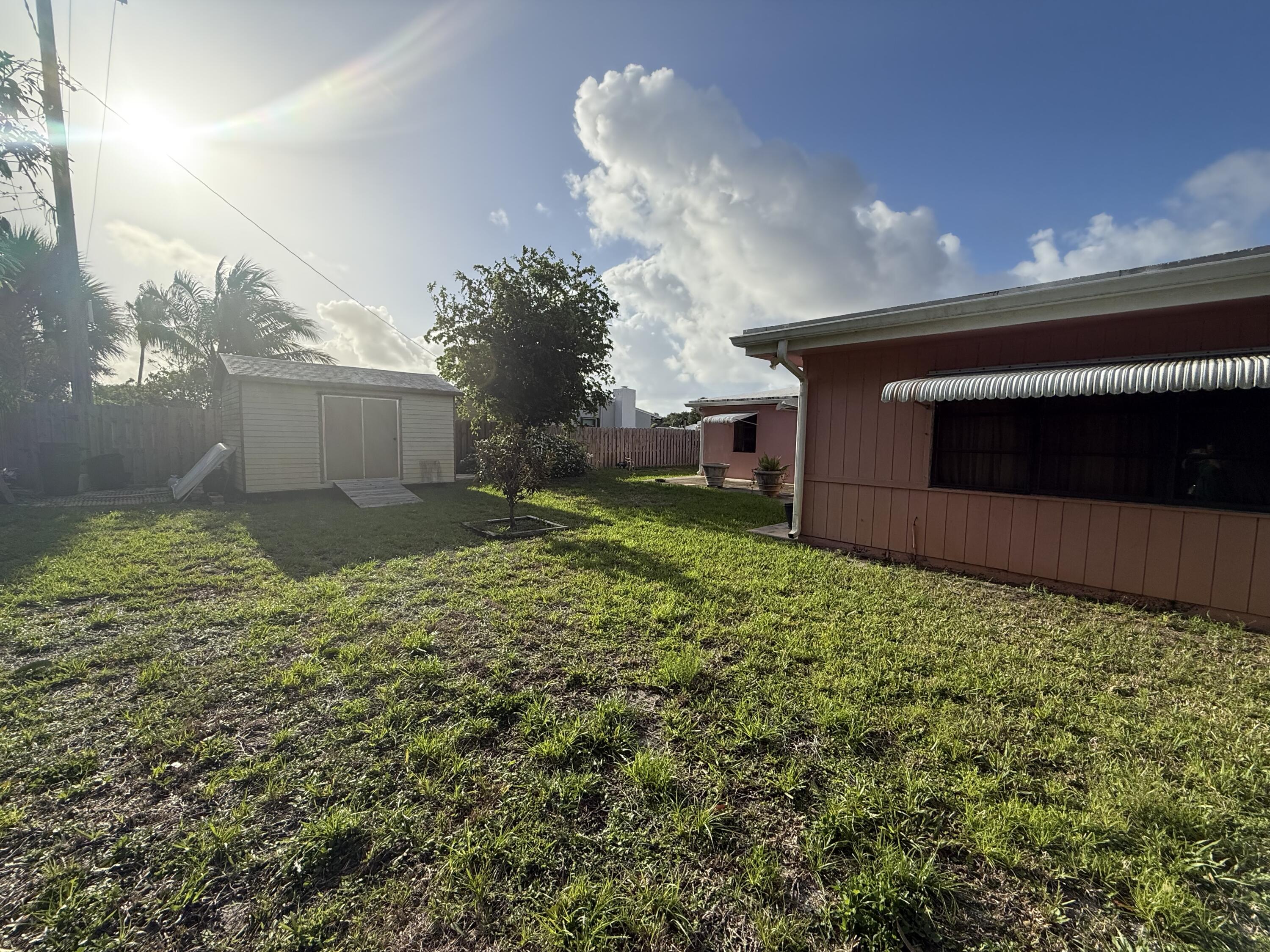 817 Elm Road West Palm Beach, FL 33409 - Photo 2 of 4 a view of a backyard of the house