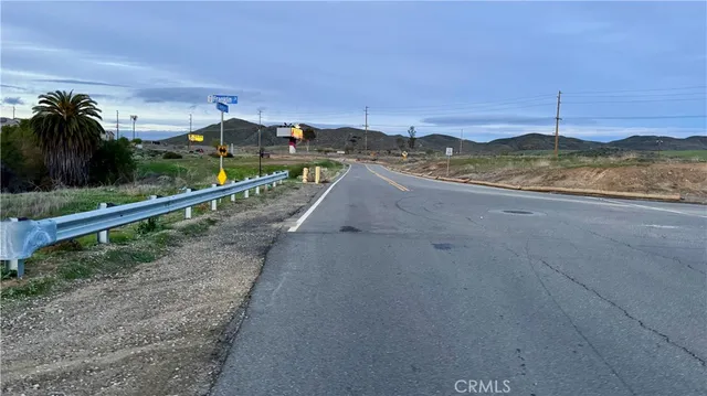 a view of a street with an ocean view