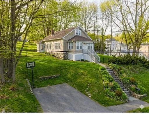 a front view of a house with garden