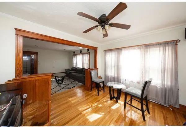 a dining room with furniture and window