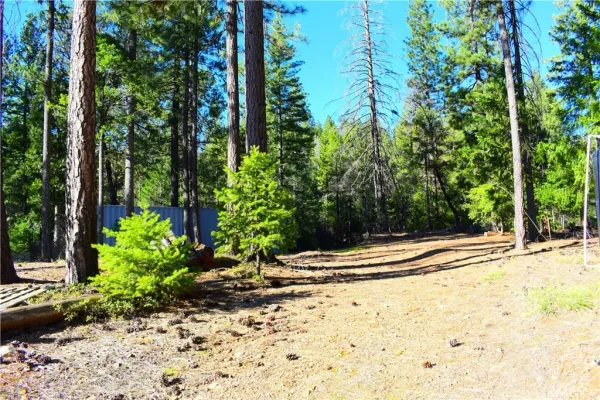a view of a porch with wooden fence